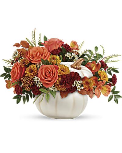 <div id="mark-3" class="m-pdp-tabs-marketing-description">Add a touch of enchantment to your fall gatherings with this magnificent mix of autumnal roses and mums, gathered in a white ceramic pumpkin that's sure to be an annual décor favorite!</div>
<p>&nbsp;</p>
<div id="desc-3">
<ul>
<li>Orange roses, orange alstroemeria, miniature maroon carnations, and yellow viking daisy spray chrysanthemums are accented with white waxflower, red cottage yarrow, huckleberry, grevillea, brown copper beech, and yellow preserved oak leaves.</li>
<li>Delivered in a white keepsake pumpkin.</li>
</ul>
</div>