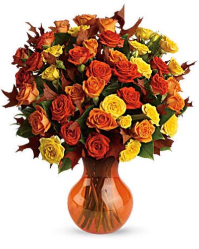 <p>Natural amber comes in every shade of gold - and this striking display of fresh spray roses in autumn's favorite hues of gold and orange, accented with a few oak leaves, is perfectly precious! A lovely pick-me-up for a crisp fall day.<br />
Yellow, orange and light-orange spray roses - accented with preserved oak leaves and lemon leaf - are delivered in a sparkling orange Serendipity vase.</p>