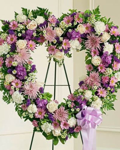 <p>The passing of a beloved family member or friend is a sad and difficult time. You want to convey your deepest sympathies to those left behind while also remembering and celebrating a beautiful life. This striking, heart-shaped tribute is crafted by our expert florists from delicate lavender and white blooms and is a beautiful expression of all the love you feel in your heart. Traditionally sent directly to the funeral home by family members or friends and displayed on a stand.</p>