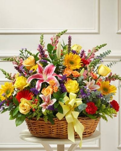 <p>In times of sorrow and loss, finding the perfect expression sympathy can be difficult. Let them know there are brighter days ahead with this elegant willow basket full of fresh and colorful blooms. Expertly crafted by our florists, orange spray roses, lilies, sunflowers, Gerbera daisies, carnations and more are gathered to offer comfort while also serving as beautiful tribute to a life well lived. Have it to the funeral home or directly to the home of the family.</p>