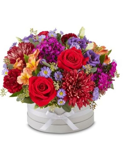 <p>EXCLUSIVE The beauty of fall, captured in flowers. Our richly colored arrangement is gathered in our signature European hatbox: a dove gray container finished with a matching ribbon. This bright and wistful bouquet adds a splash of harvest beauty to any space or celebration.</p>